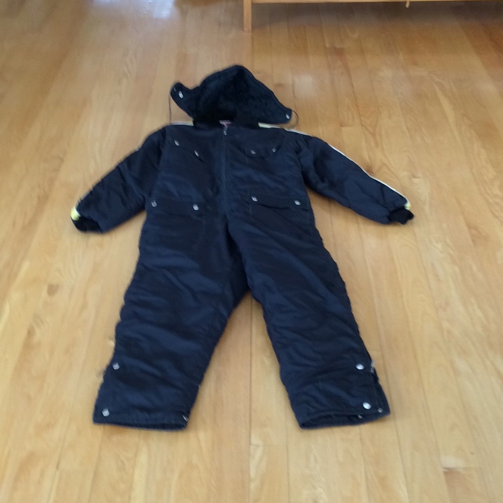 Size S black snowmobile suit with attached hood.
